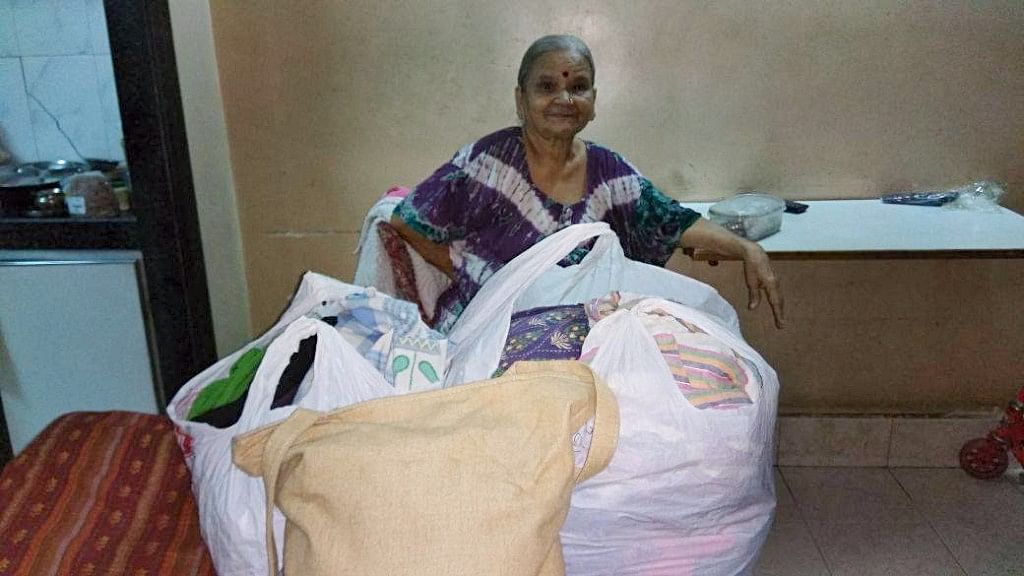 A woman with her donations for the Street Funder.