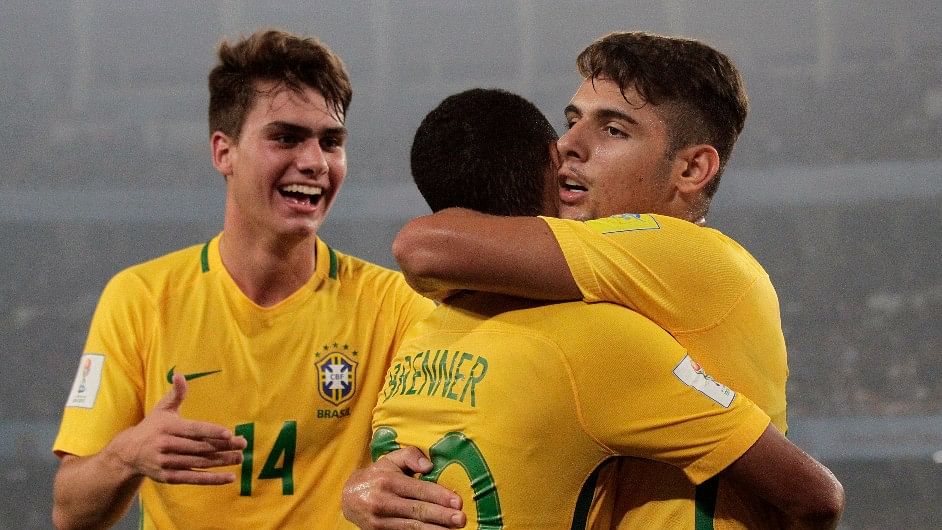 Brazil’s Yuri Alberto, right, celebrates with teammates after scoring a goal against Mali.