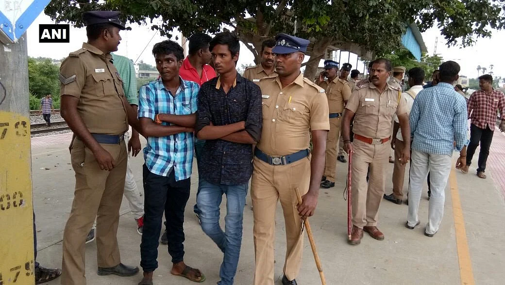 The students being escorted by the police.
