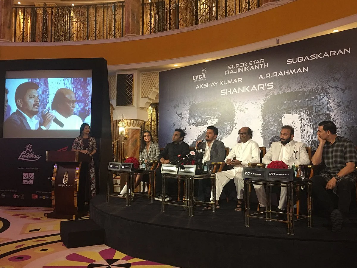 The cast and crew address the press. 