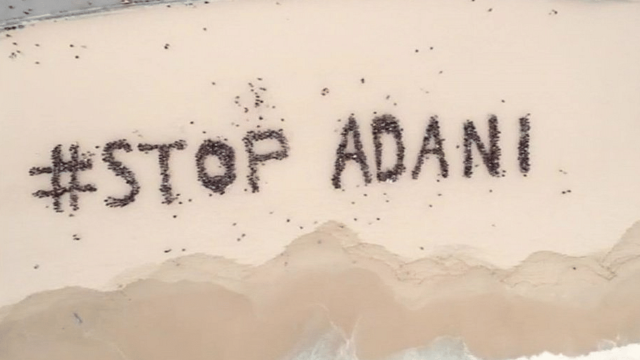 Australians on Bondi beach protest against the proposed Carmichael mine to be operated by the Adani group.