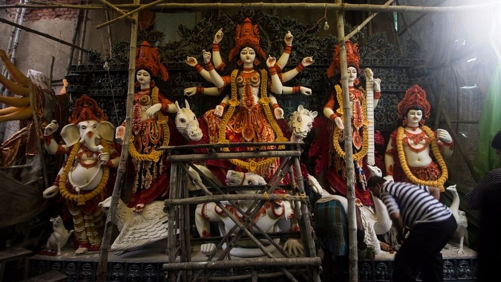 Take a look at the celebrations, farewells and last glimpses of Durga Pujo.