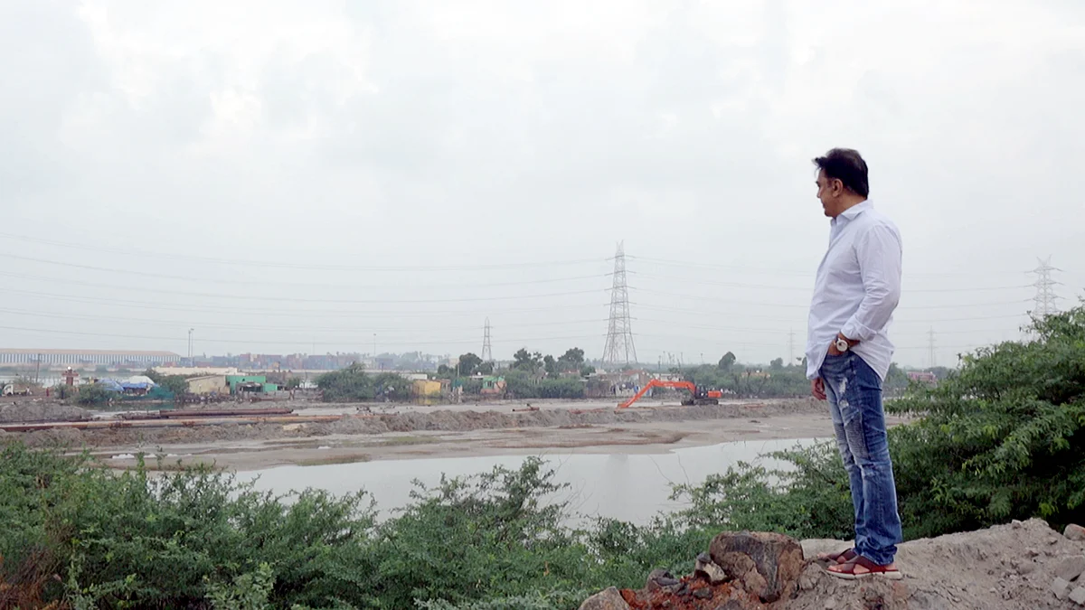 Kamal Haasan in a pensive mood near the lake.