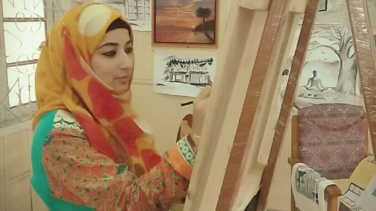 

Artist Mehnaz Gani paints at the Department of Music and Fine Arts, University of Kashmir.