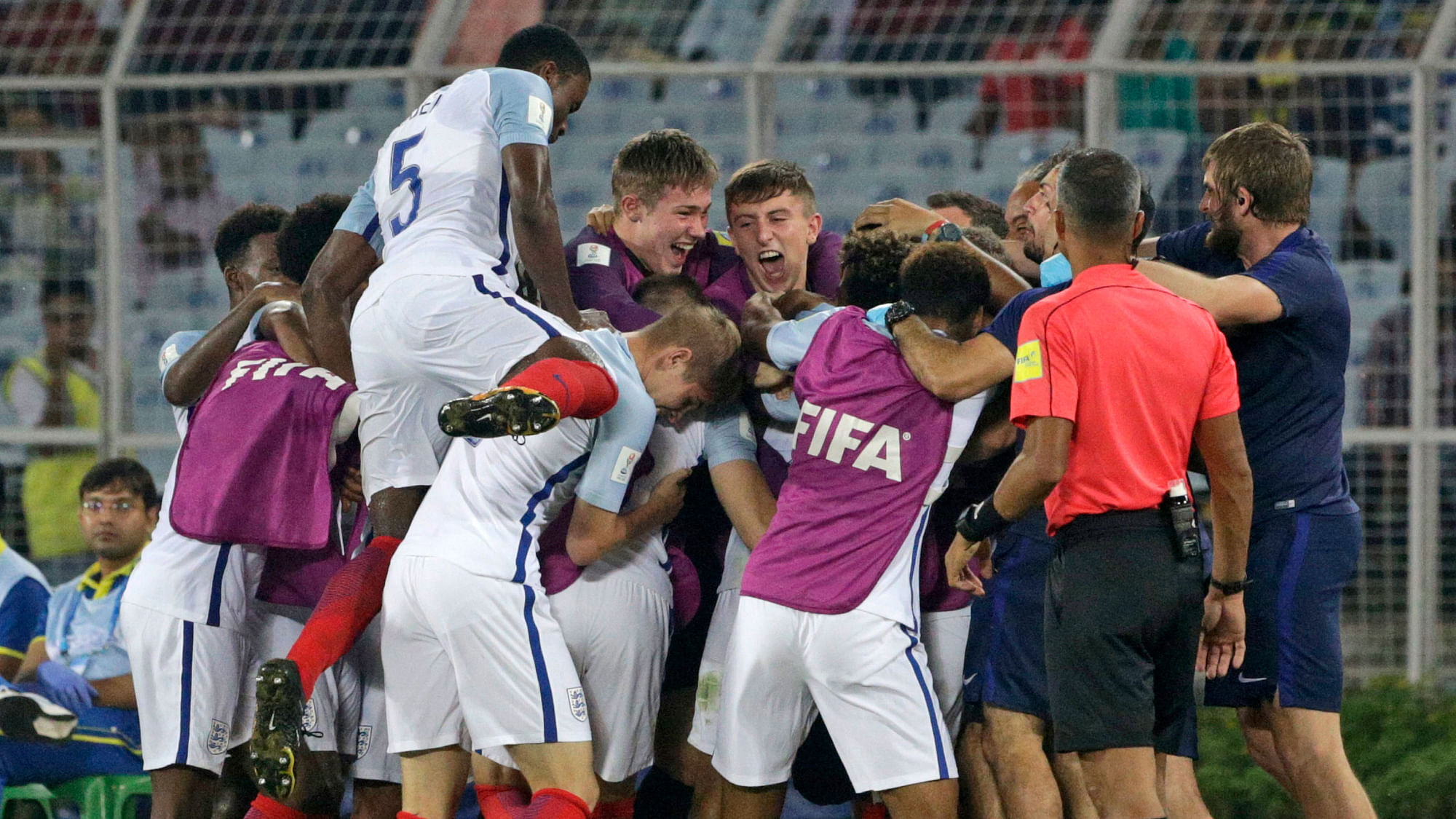 The England team celebrate after beating Brazil.