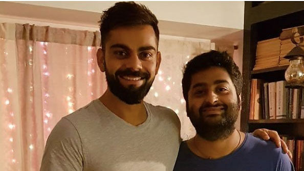 Virat Kohli posted a picture with Arijit Singh.