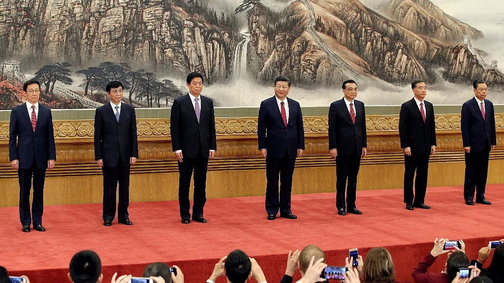China’s Politburo Standing Committee members (L-R) Han Zheng, Wang Huning, Li Zhanshu, Xi Jinping, Li Keqiang, Wang Yang and Zhao Leji, line up as they meet with the press at the Great Hall of the People in Beijing. File Photo.