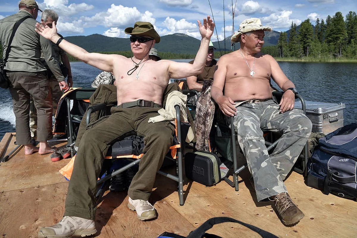 A rare photo of Vladimir Putin (centre) on vacation!