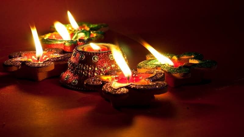Lighting earthen lamps during Diwali is a common practice.