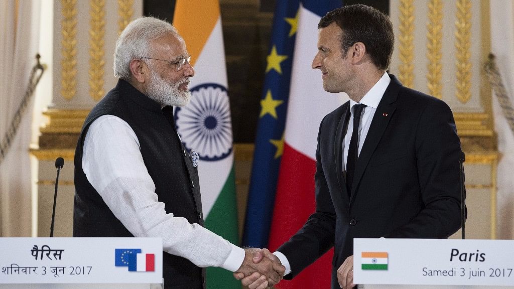 French President Emmanuel Macron (R) and Indian Prime Minister Narendra Modi, shake hands at the end of a joint statement after their meeting at the Elysee Palace in Paris on 3 June 2017.&nbsp;