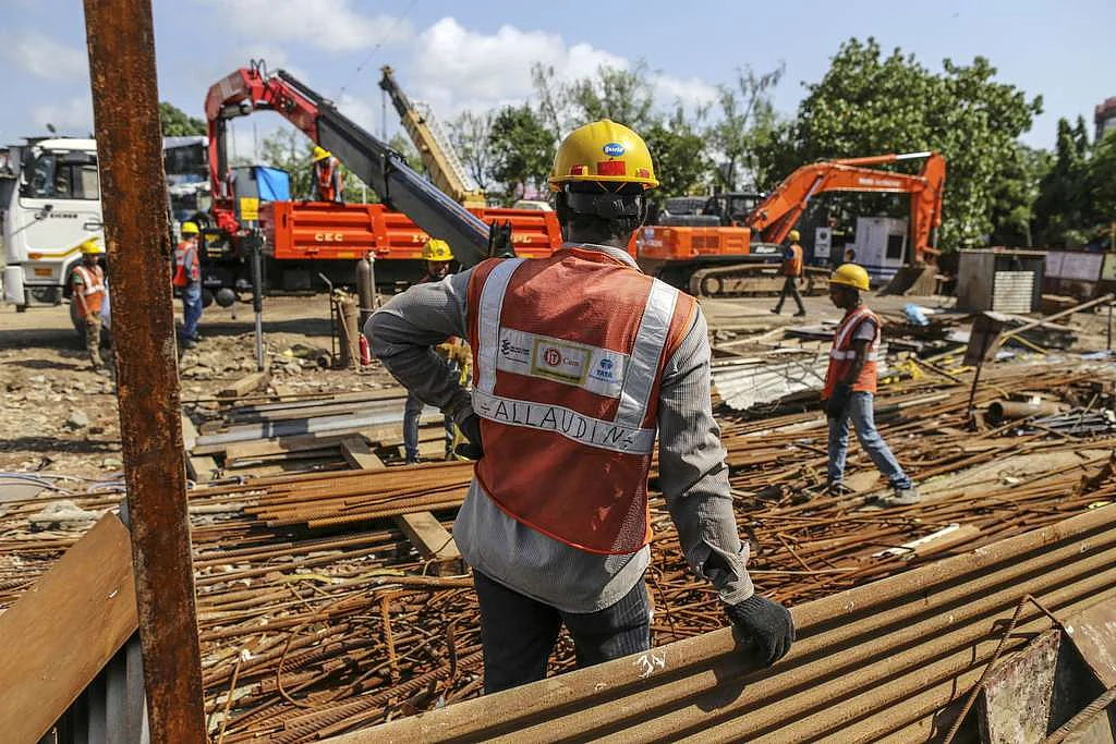 Workers prepare reinforcing steel at the excavation site of a launching shaft for Metro Line 3, operated by the Mumbai Metro Rail Corp. 