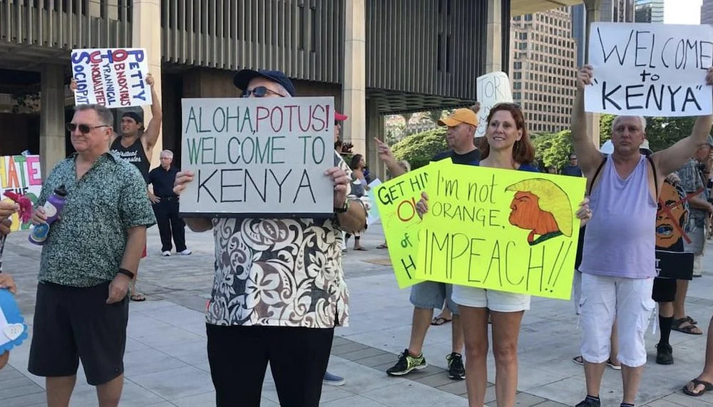 Protesters in Hawaii troll Trump by greeting him with ‘Welcome to Kenya’ posters. 