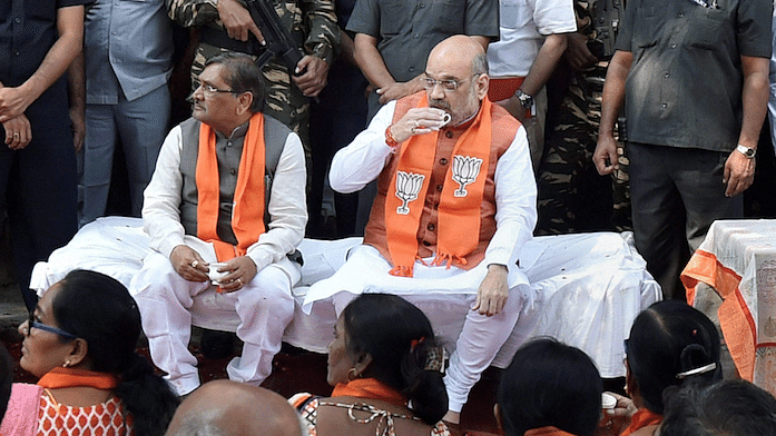 BJP National President Amit Shah along with party leaders and workers listening to Prime Minster Narendra Modi’s “Mann Ki Baat” over tea, at  in Ahmedabad on Sunday, 26 November.&nbsp;