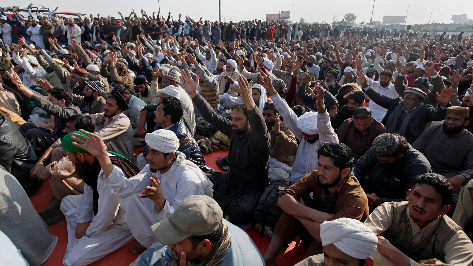 Protesters shout slogans during a sit-in protest near  Islamabad on Monday, 20 November.&nbsp;