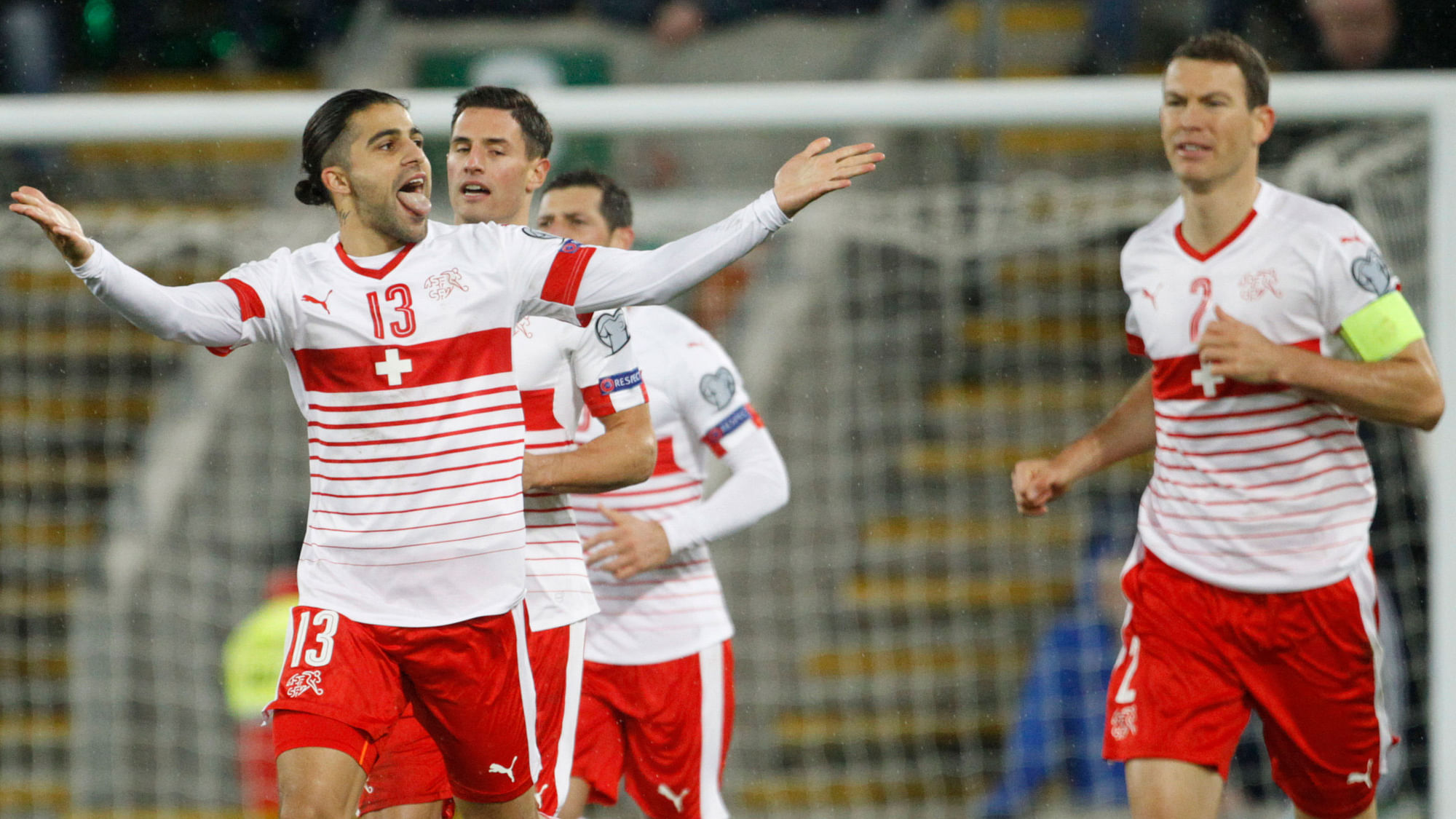 Switzerland’s Ricardo Rodriguez, left, celebrates after scoring the opening goal during the World Cup qualifying play-off first leg soccer match against Northern Ireland.<a></a>