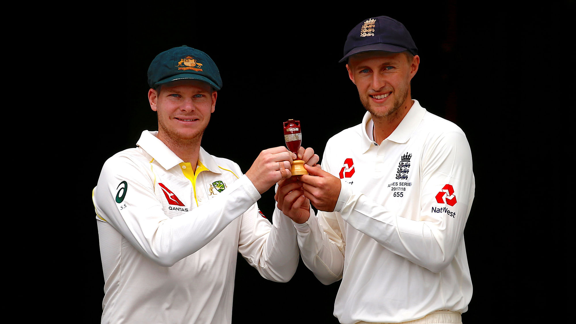 File picture of Australian skipper Steve Smith and his English counterpart Joe Root  hold a replica Ashes trophy.