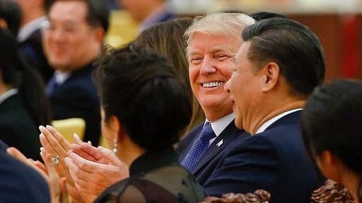 President Donald Trump and China’s President Xi Jinping attend at a state dinner at the Great Hall of the People in Beijing.