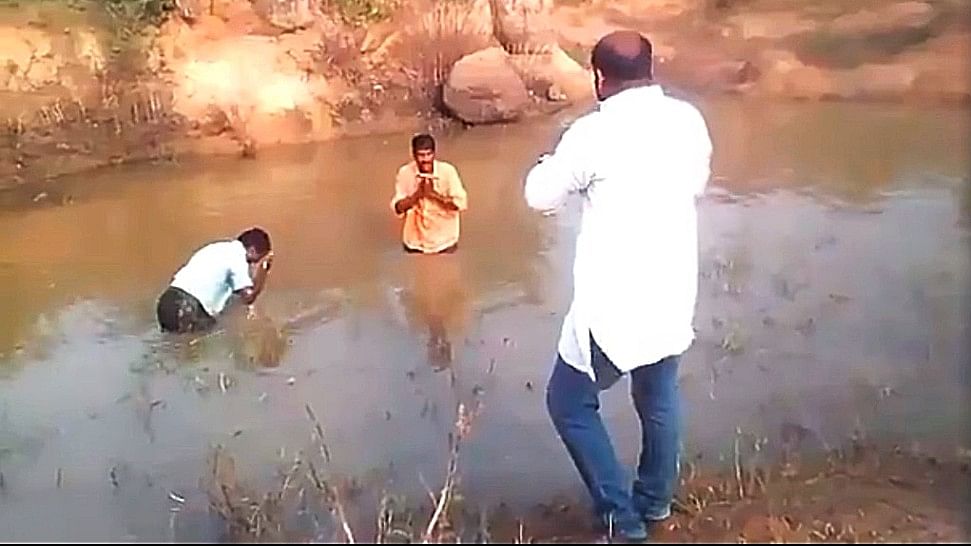 The video shows the alleged BJP leader forcing the men to dunk themselves in muddy water.