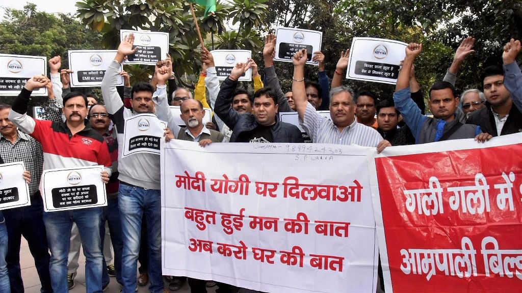 Homebuyers raise slogans and protest against builders at Patel Chowk metro station, in New Delhi on 18 November 2017