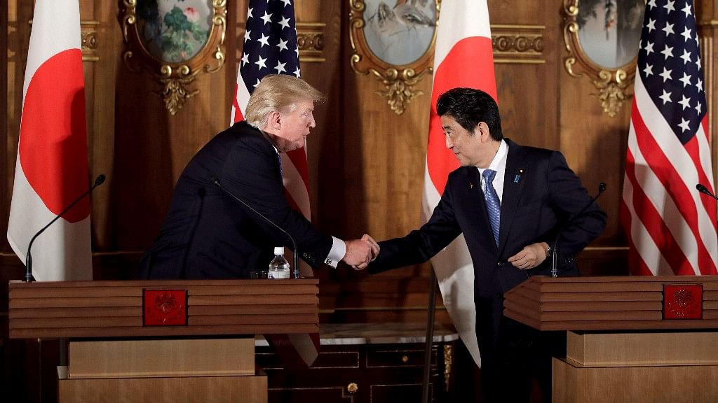 President Trump and Japanese Prime Minister Shinzo Abe shake hands during a joint news conference at the Akasaka Palace, Tokyo on 6 November 2017