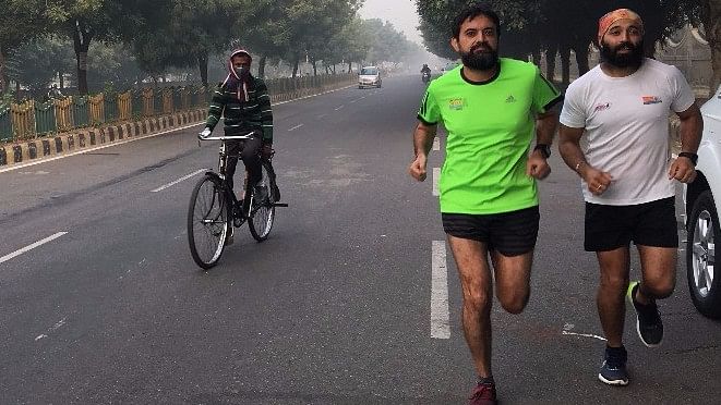 Intense smog in Delhi can’t stop these runners from doing what they love – running!
