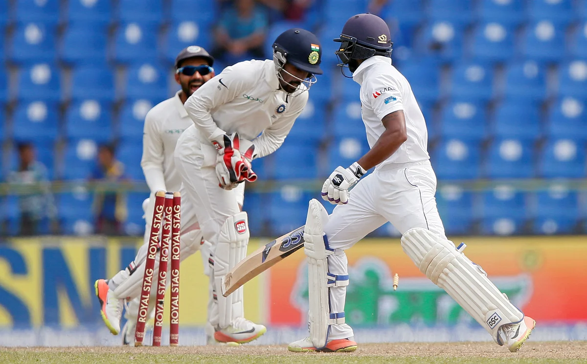 Wriddhiman Saha effects a stumping to dismiss Sri Lanka’s Niroshan Dickwella.