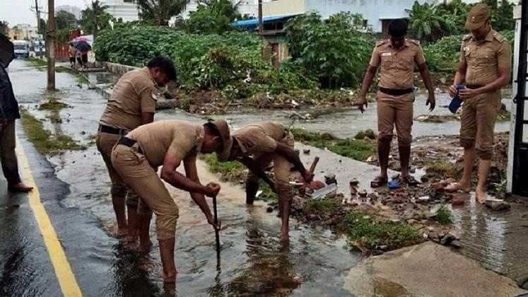 Chennai police jump into action in the middle of the  rains.