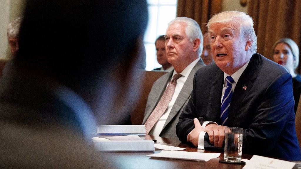 Secretary of State Rex Tillerson listens as President Donald Trump announces that the United States will designate North Korea a state sponsor of terrorism during a cabinet meeting at the White House.