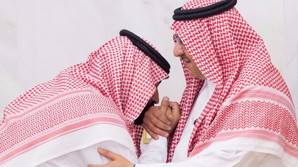 In this Wednesday, 21 June  2017 photo released by Al-Ekhbariya, Mohammed bin Salman (MBS), newly appointed as crown prince, left, kisses the hand of Prince Mohammed bin Nayef at royal palace in Mecca, Saudi Arabia.&nbsp;