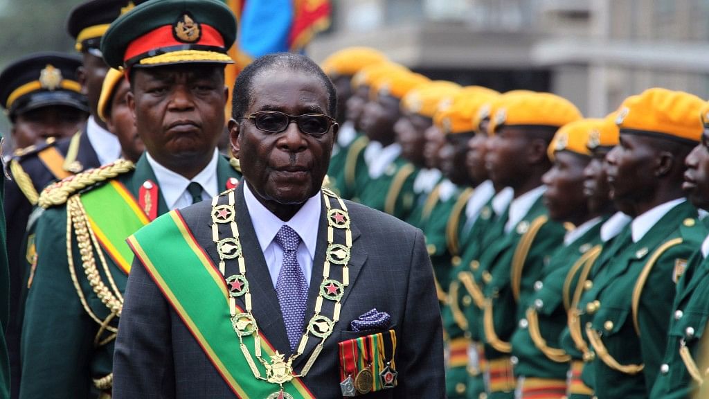 Former Zimbabwe president Robert Mugabe inspects the guard of honour in this photo from 2009.