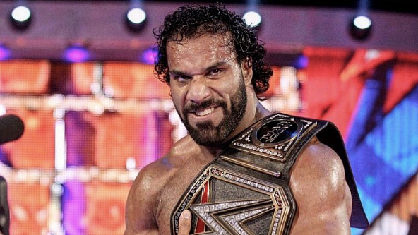 Jinder Mahal poses with this WWE champion belt.