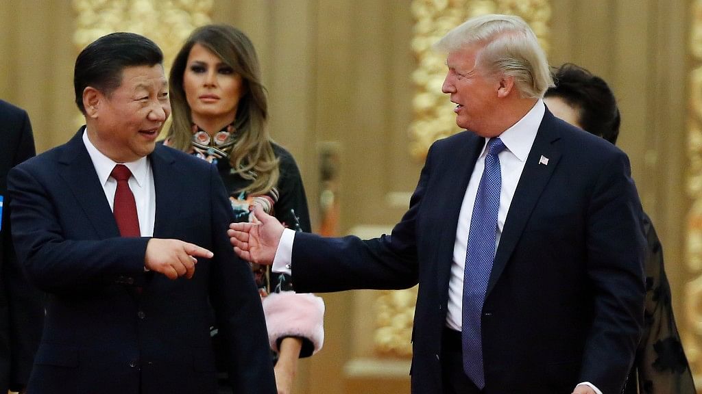 US President Donald Trump and China’s President Xi Jinping arrive for the state dinner with the first ladies at the Great Hall of the People in Beijing on 9 November&nbsp;