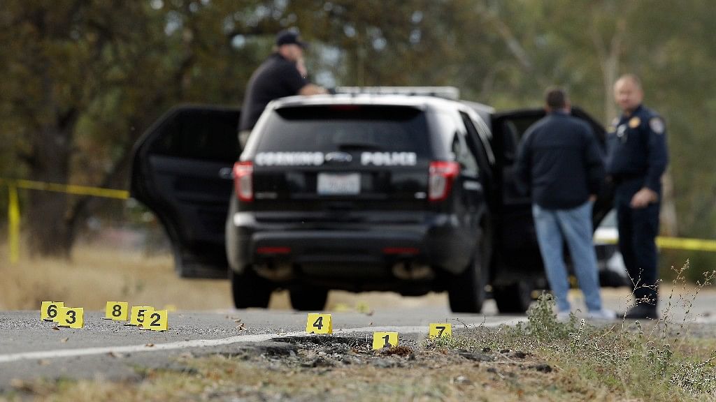 Yellow tags mark where bullet casings were found at one of the scenes of the shooting spree