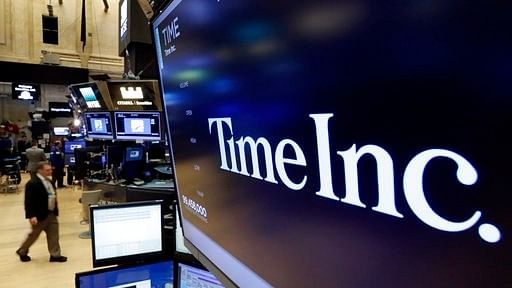 File photo, the Time Inc logo appears above a trading post on the floor of the New York Stock Exchange.