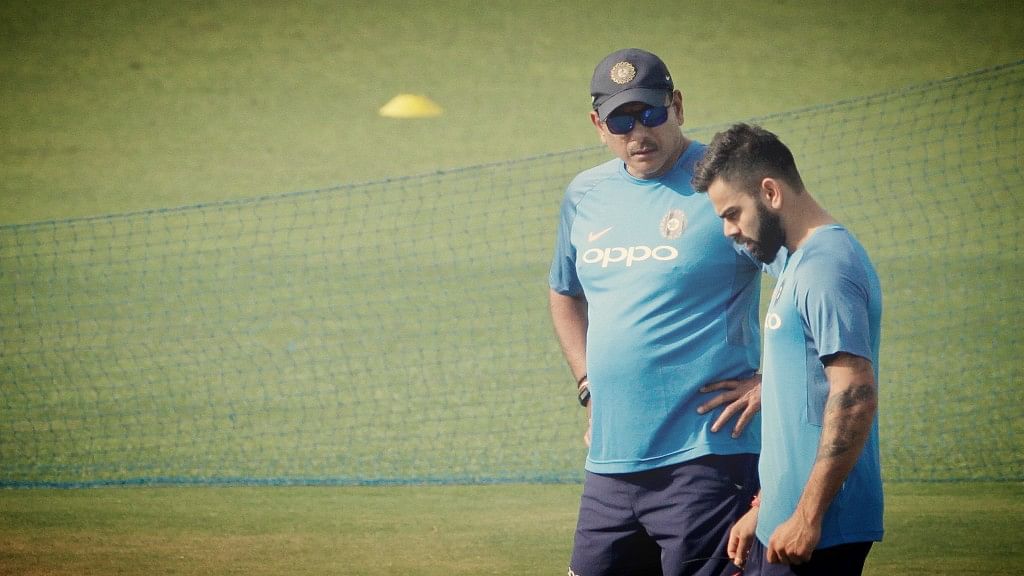 Indian skipper Virat Kohli with coach Ravi Shastri during India’s practise session at Eden Gardens.&nbsp;
