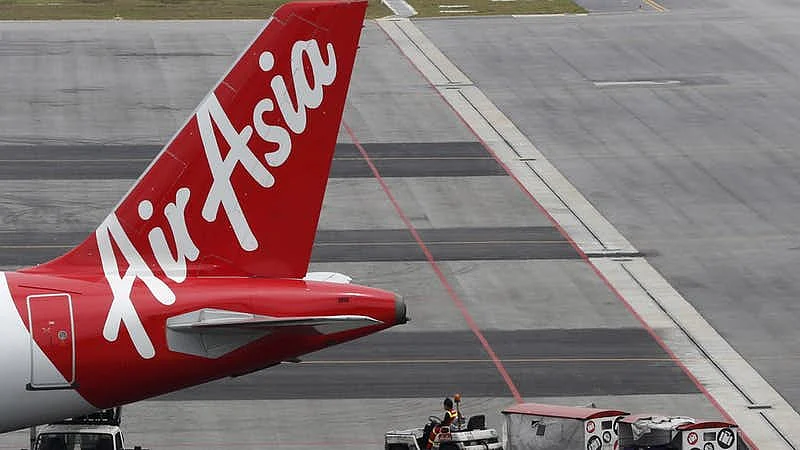 A 25-year-old woman has filed a complaint against three AirAsia employees, alleging misbehavior.