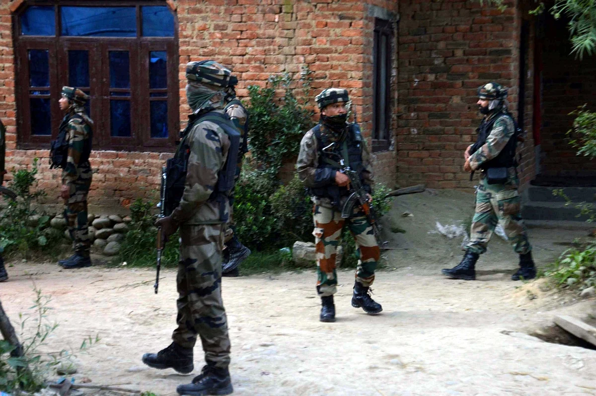 Soldiers take position after militants attacked a police vehicle killing a policeman and injuring other in Jammu and Kashmir’s Kulgam district on 14 October, 2017.