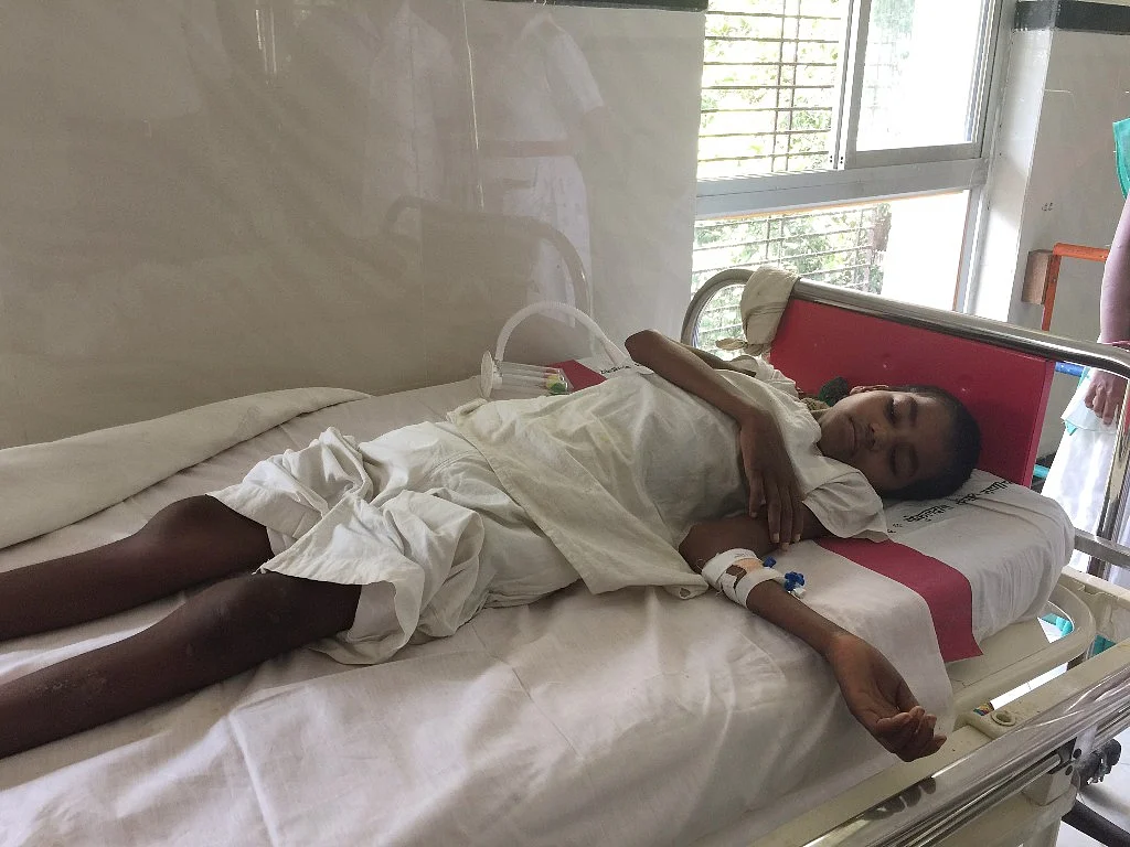 8-year-old Ravita gets ready for a check-up by her doctor.