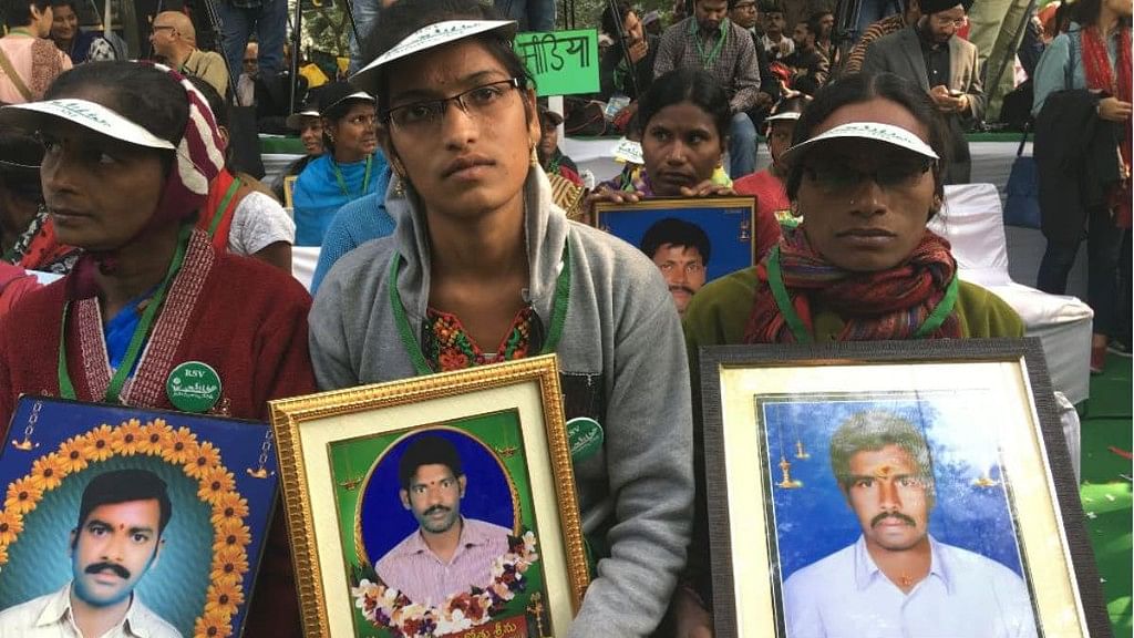 Family members of farmers who committed suicide participate in the rally in New Delhi.&nbsp;