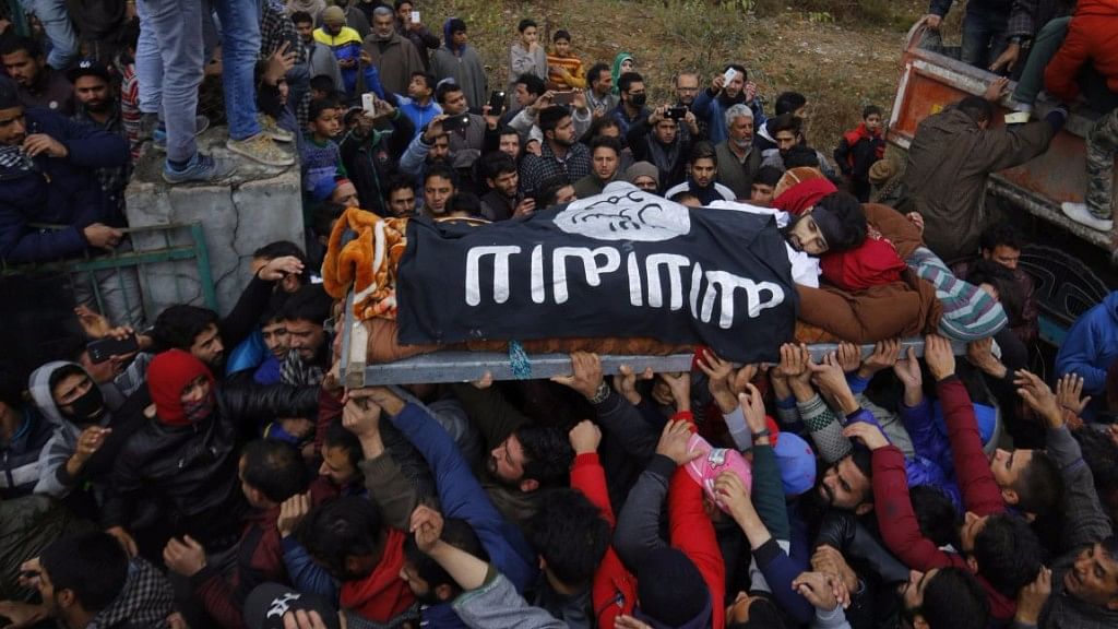 Funeral procession of the militant Mugees Ahmad Mir whose coffin was draped in ISIS flag and carried through Srinagar for burial on Sunday.