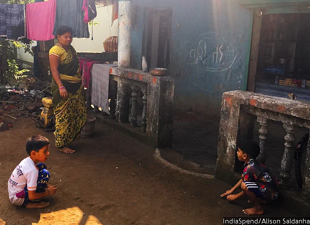 Lalita Patil and her sons Harshad and Tanish outside their home and the attached shop. Patil had reopened the store two years ago after her husband passed away in 2012. Her family of three is entirely dependent on the shop’s earnings.