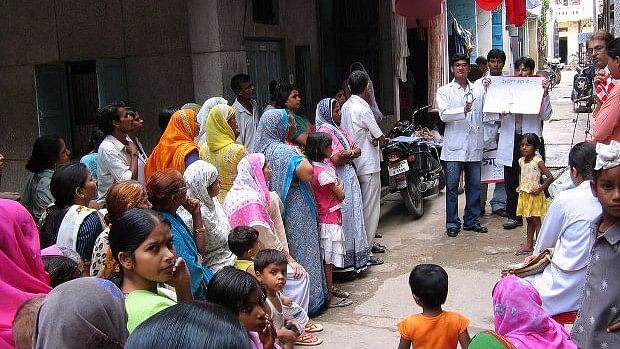 Students from the All India Institute of Medical Sciences conduct a community education programme in a Delhi slum.