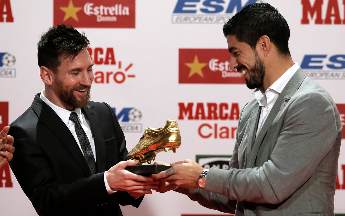 Messi was presented with the trophy by teammate Luis Suarez, who won the trophy last season.