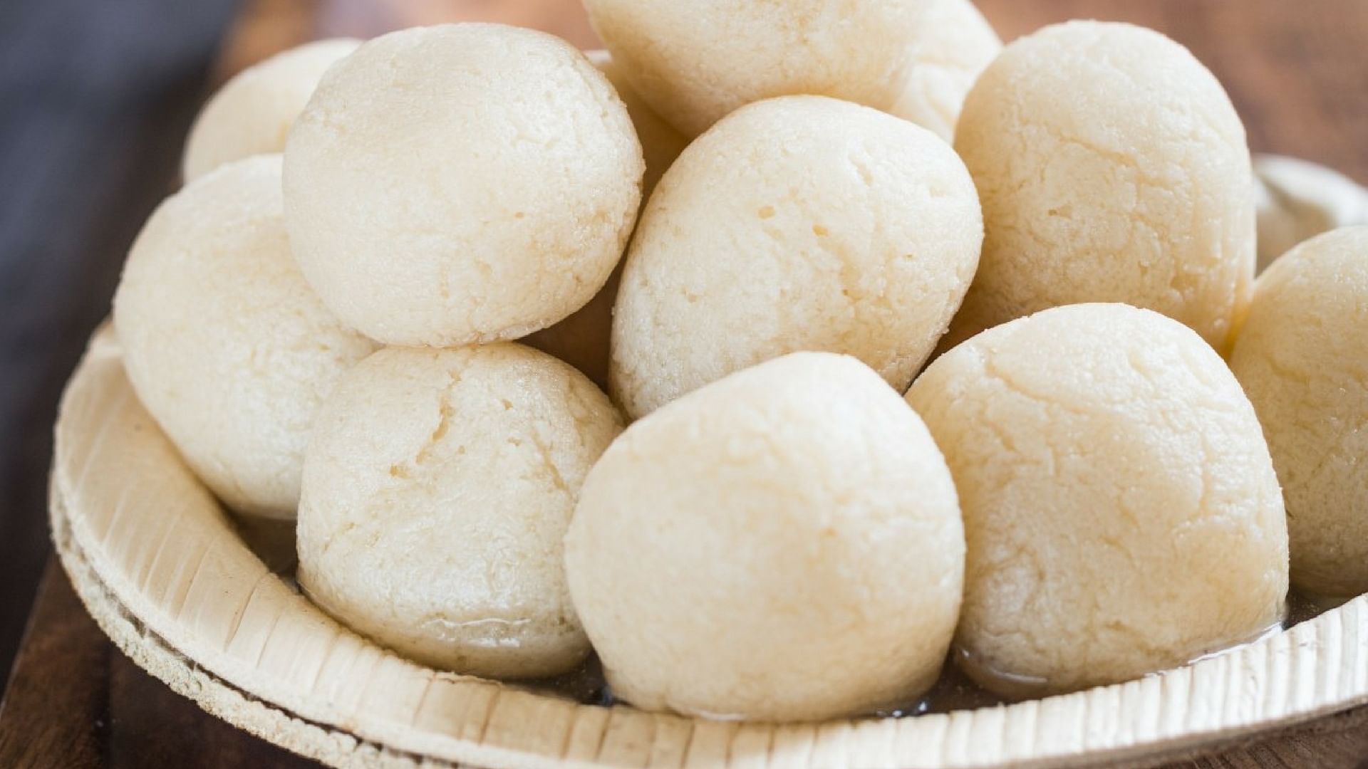 Bangladesh or india's favourite sweet rasgulla, dry rasgulla, bengal  sweets, made of milk / khoya, sweet meets, curved in a steel plate, extreme  closeup, front angle Stock Photo by ©stockimagefactory.com 115223618