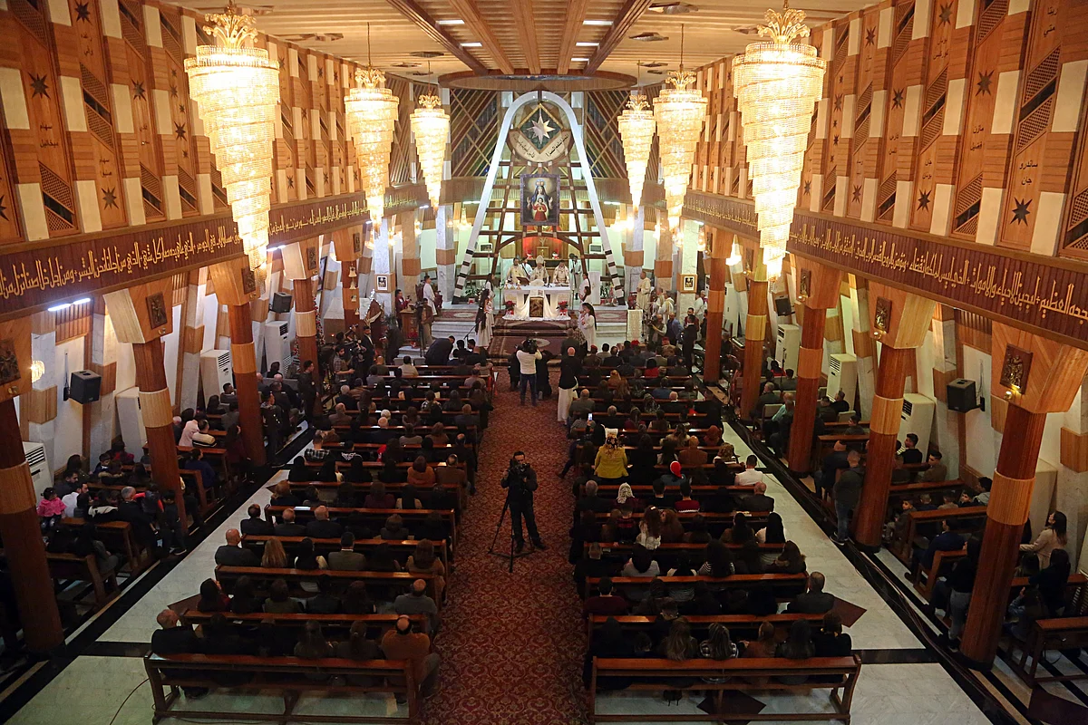 Iraqi Christians attend a Christmas Eve Mass at Our Lady of Salvation Church in Baghdad on Sunday, 24 December 2017.