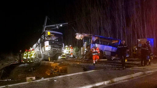 A regional train hit a school bus on a crossing in southern France on, killing four children and critically injuring seven other people on the bus.