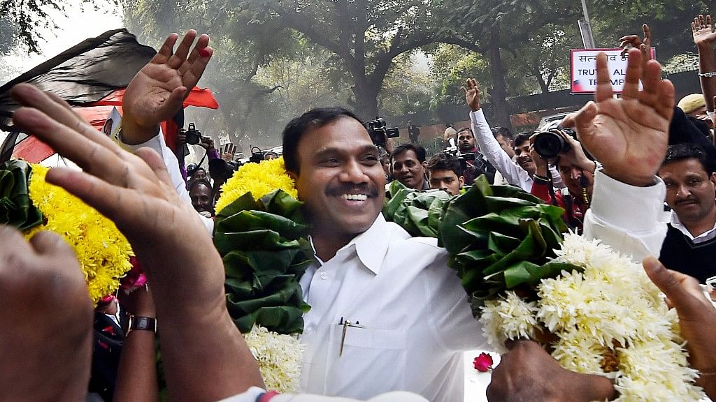 Former Telecom minister A Raja reacts as he celebrates along with his supporters after he was acquitted by a special court in the 2G scam case, in New Delhi.