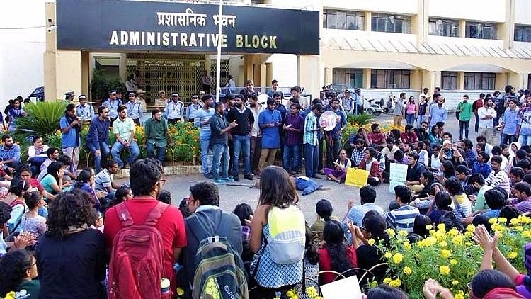 Students gathered outside the administrative block of the university in protest against the suspensions.