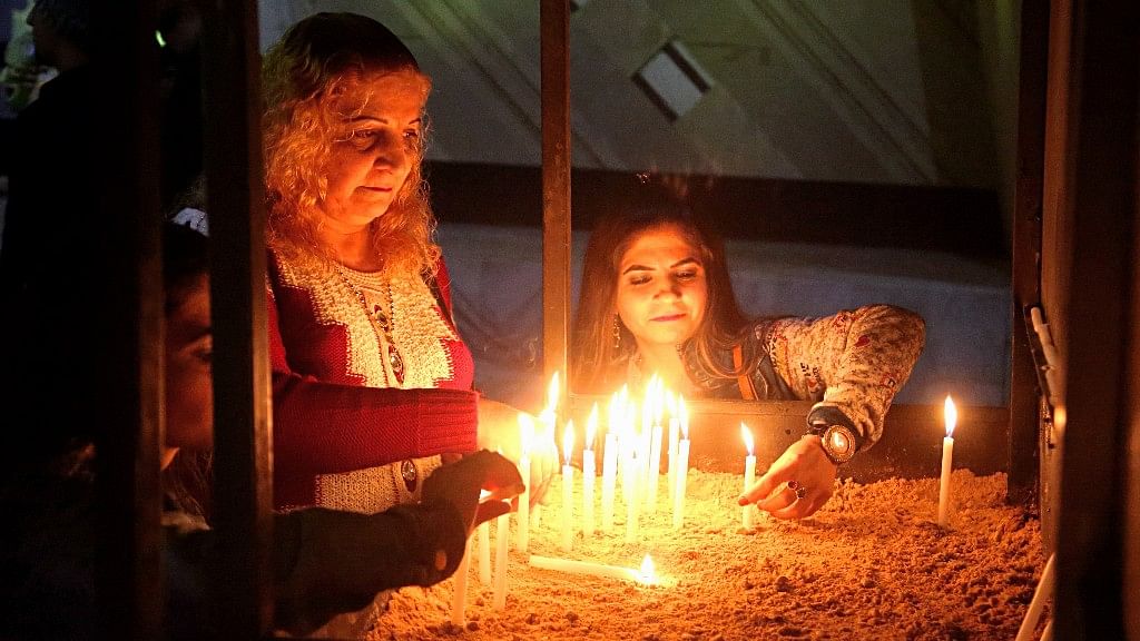 Iraqi Christians attend a Christmas Eve Mass at Our Lady of Salvation Church in Baghdad on Sunday, 24 December 2017.&nbsp;