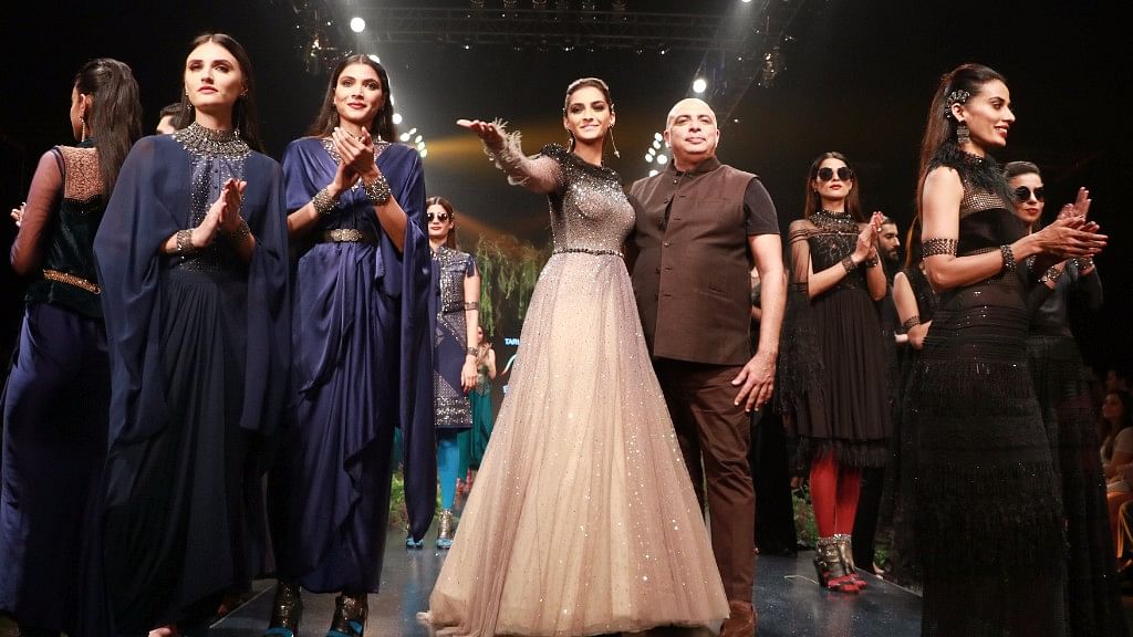 Sonam Kapoor and designer Tarun Tahiliani on stage at the fashion show.